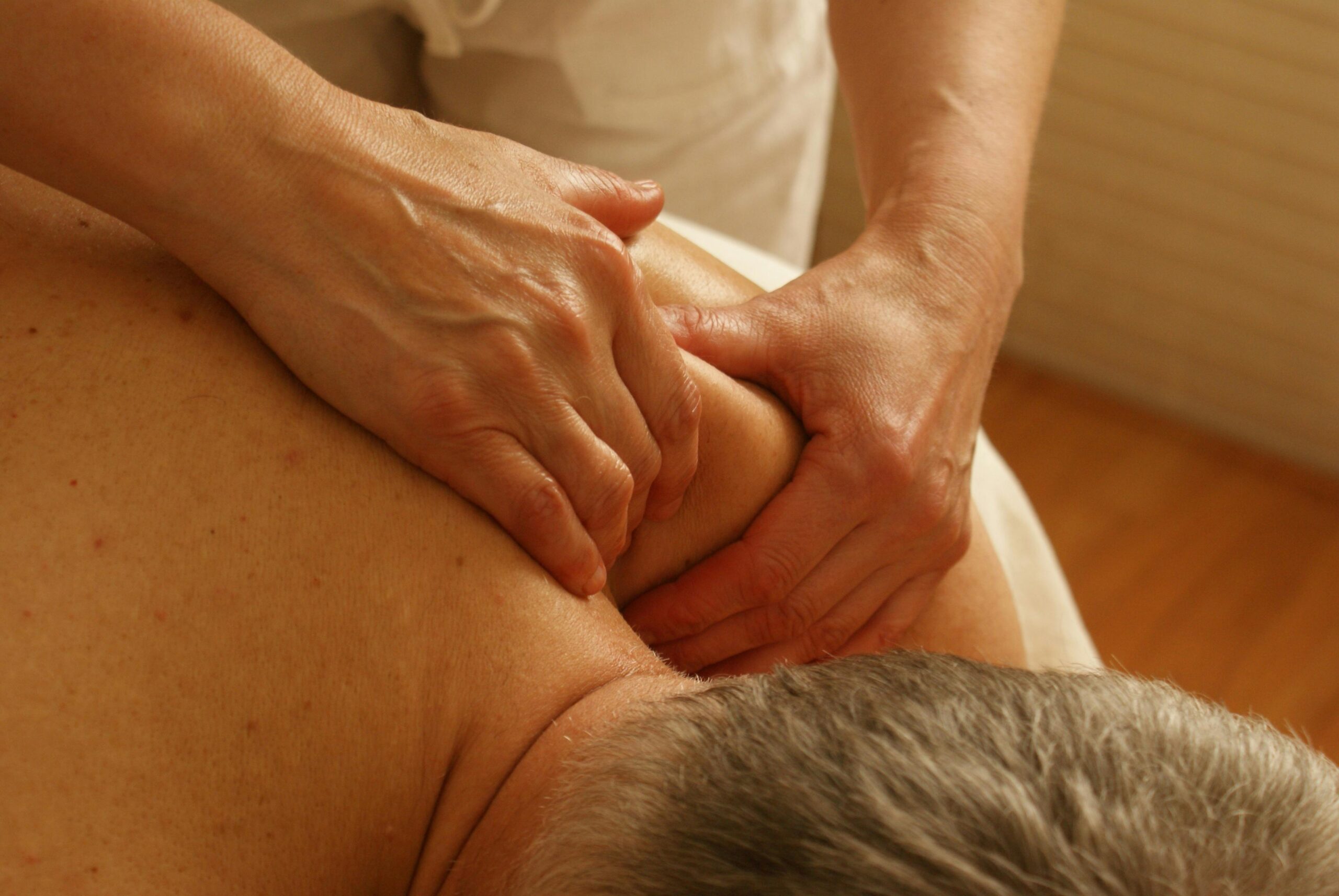 A client receives a massage at a Vicars Giving Clinic.